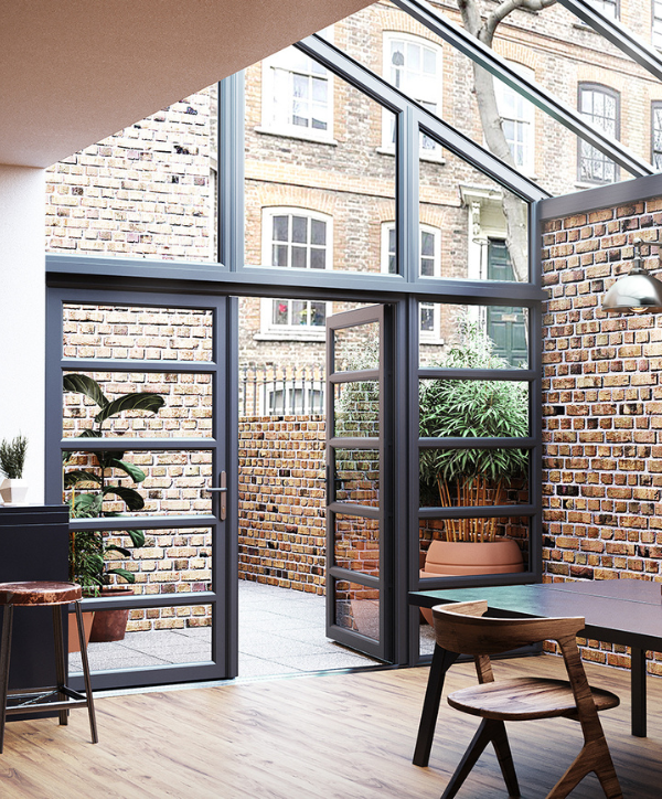 Modern conservatory interior as an extension to the kitchen with an open floor plan